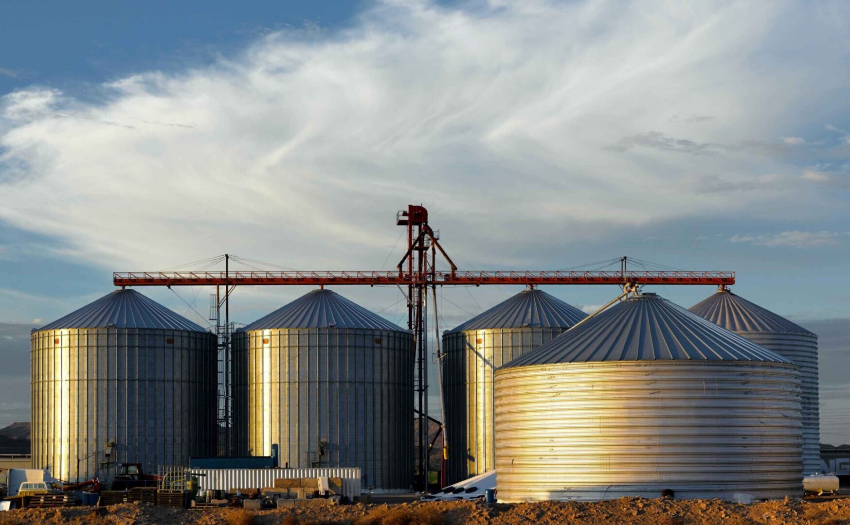 A group of silos in the middle of an area.